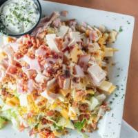 Chef Salad · Mixed greens, tomatoes, cucumbers, chopped cheeses, ham, turkey and bacon.
