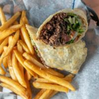 Burger Wrap · Lillian’s delicious burger wrapped up! Lettuce, tomato, onion, shredded cheese and pickle.