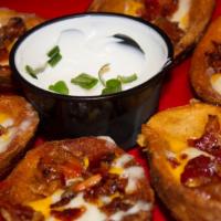 Loaded Potato Skins · Six skins loaded with cheese and bacon.
