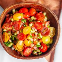 Shirazi Salad · Cucumbers, tomatoes, onion, parsley, with EVOO citrus dressing.