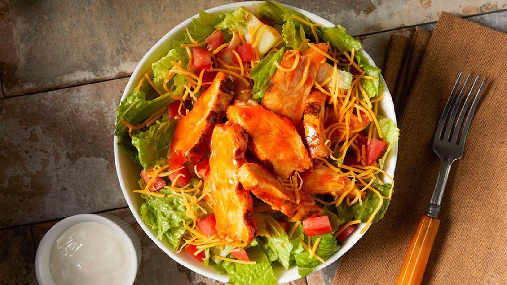 Buffalo Chicken · Romaine, grilled chicken, cheddar, Roma tomato, celery salt, Buffalo sauce & your choice of ranch or bleu cheese dressing