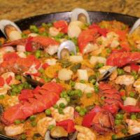 Paella Valenciana · Chicken, chorizo, shrimp, scallop, calamari and mussle.