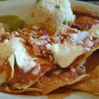 *Huevos Divorciados (2) · Sunny side up eggs over chilaquiles, cheese, sour cream, onions, green and red sauce, rice, ...