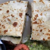 Quesadilla Fajita · With cheese, grilled chicken or *steak, bell peppers, onions, refried beans, and rice. +*Ste...