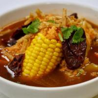 Caldo Tlalpeno · A delicious chicken soup it includes, corn, potatoes, chayotes, chipotles, rice, topped with...