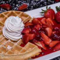 Strawberries And Waffles · Buttermilk Waffle Topped with Strawberry Sauce and Whipped Cream