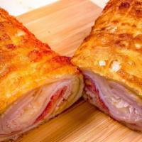 Caribbean Monte Cristo · Grilled white Turkey meat, ham, melted Swiss & cheddar cheese wrapped in a (12inch flour whi...