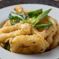 Salt & Pepper Calamari · Spicy. Fried calamari tossed with salt, garlic, jalapeño, pepper, and scallion.