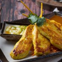 Chicken Satay (4 Pcs) · Grilled marinated chicken on skewers served with peanut and sweet cucumber sauce.
