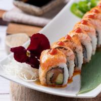 Spicy Salmon Roll* · Spicy. Salmon, avocado, fish egg, scallion inside out roll, topped with seared salmon, srira...