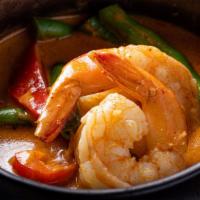 Panang Curry · Spicy. Panang curry paste, coconut milk, bell pepper, green bean, kaffir lime leaves and pea...