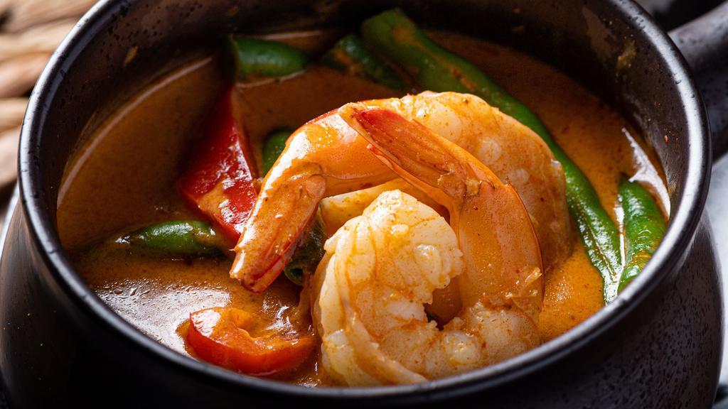 Panang Curry · Spicy. Panang curry paste, coconut milk, bell pepper, green bean, kaffir lime leaves and peanut.