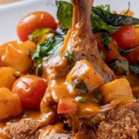 Crispy Duck Red Curry · Mild spicy item. Crispy duck, red curry paste, coconut milk, bell pepper, basil leaves, pine...