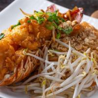 Lobster Pad Thai · Lightly battered fried eight ounces-lobster tail on top of pad Thai noodle. Not served with ...
