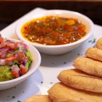 Arepitas ''Paisas'' Con Guacamole Y Hogao · Fried mini colombian ''arepas'' with guacamole and a colombian sauce made of tomatoes, scall...