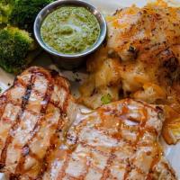 Pollo Con Salsa De Cilantro · Wood grilled chicken breast (10oz). Served with mashed potato loaded with corn and melted ch...