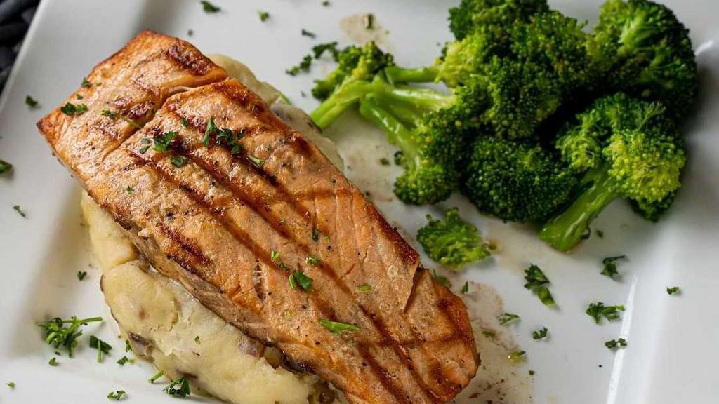 Fillet De Salmon · Fresh grilled salmon. Served with mashed potatoes and seasonal vegetabls.
