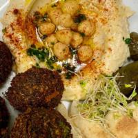 Appetizer Sampler Platter · Five falafel, hummus, stuffed grape leaf, fetta cheese served with white or whole wheat pita.