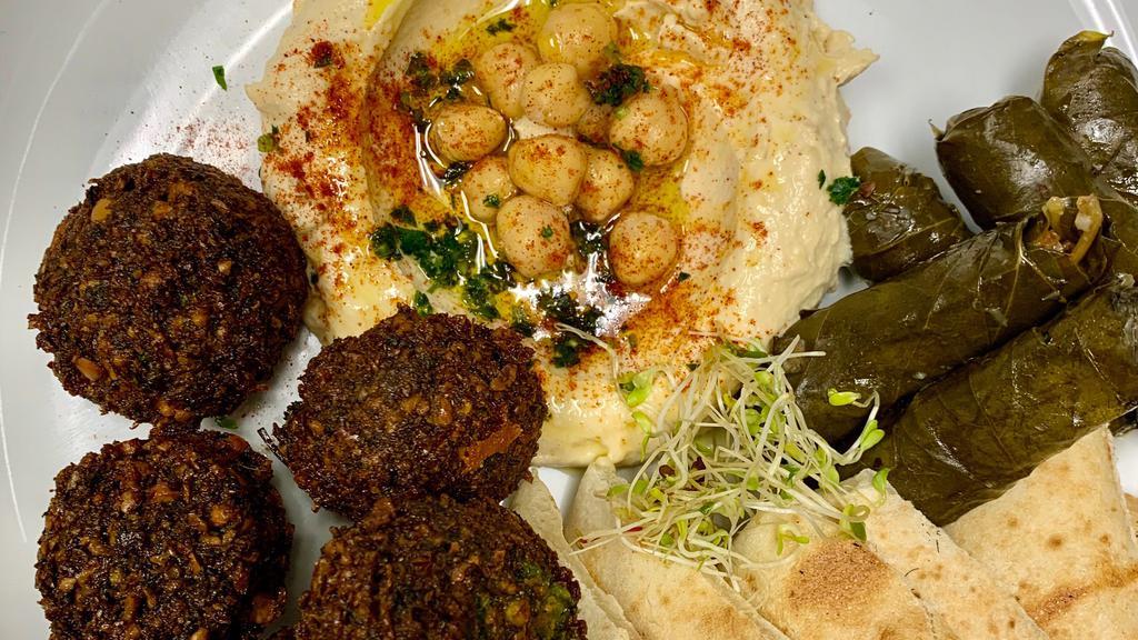 Appetizer Sampler Platter · Five falafel, hummus, stuffed grape leaf, fetta cheese served with white or whole wheat pita.