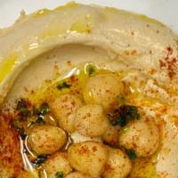 Hummus · Freshly made hummus topped with garbanzo beans, parsley, spices and extra virgin olive oil. ...
