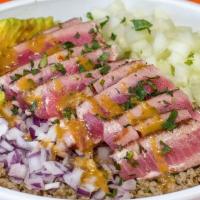 Seared Tuna Bowl · Seared Tuna on a bed of quinoa carrots red onion cucumber avocado topped with cilantro sesam...