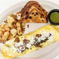 Steak Poblano Omelette · Steak, poblano peppers, onions, mushrooms, queso fresco, and spicy green salsa.