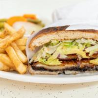 Torta De Milanesa · Breaded chicken breast, tomatoes, lettuce, onion, jalapeños, queso fresco, mayonnaise and bl...