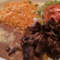 Carnitas · Slow cooked pork tips. Served with rice, beans, lettuce, pico de gallo, and guacamole.
