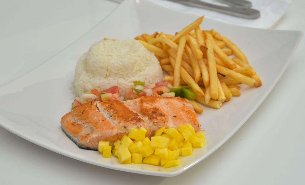 Grilled Salmon Fillet · Grilled salmon fillet topped with traditional mango vinaigrette. Served with rice and French fries.