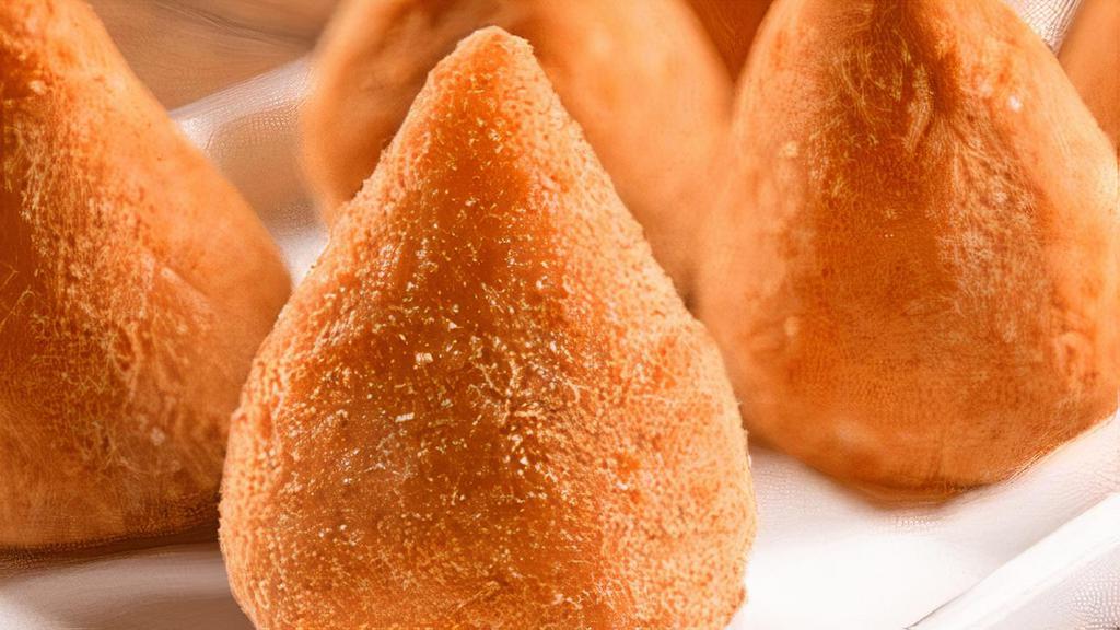 3 Coxinhas  ( Chicken Croquettes ) · A brazilian traditional consisted on minced chicken with creamy catupiry wrapped in a soft dough, breaded and deep fried to perfection. Each portion comes with 3 coxinhas.