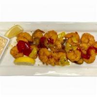 Wagon Wheel Shrimp · Lightly battered and deep fried. Tossed in. garlic butter with sweet & spicy peppers. Ranch....
