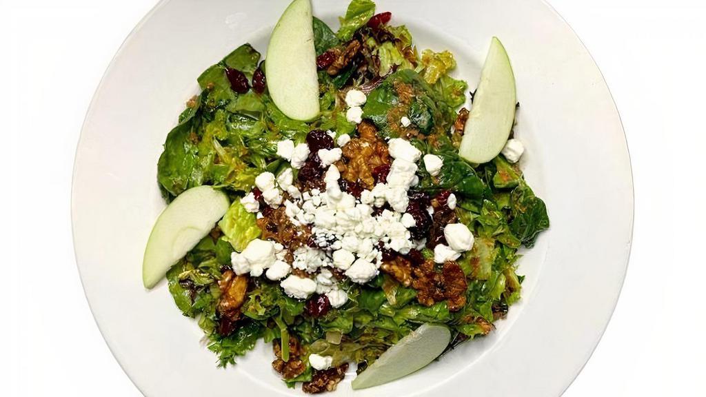 Crossing Salad · Mixed field greens & baby spinach, topped with. granny-smith apples, candied nuts, dried cranberries, &. crumbled goat cheese. Served with warm. bacon-vinaigrette.