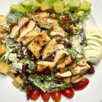 Cobb · Mixed greens and romaine, grilled chicken, bacon,. avocados, eggs, Bleu cheese, grape tomato...