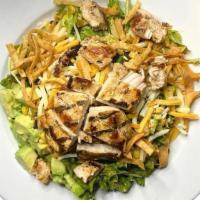 Southwest Chicken · Marinated chicken, black beans, roast corn, avocado chunks. and shredded cheese. Served on m...