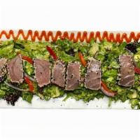 Ahi Tuna Salad · Seared rare. Served over mixed field greens with. red onions, tomatos and topped with our ho...