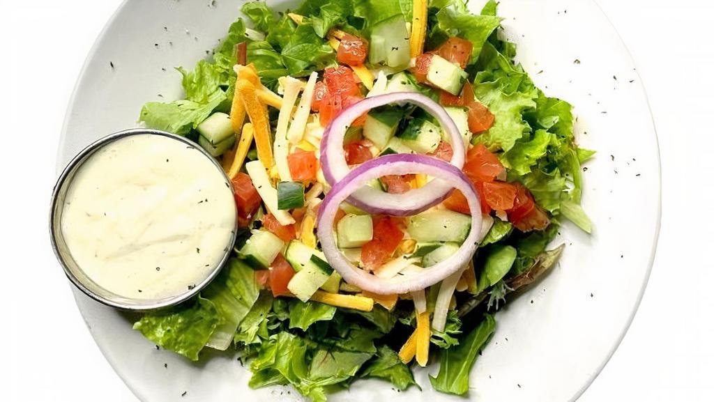 Traditional Side Salad · Crisp romaine lettuce, diced cucumbers, tomatoes, red. onions and garnished with shredded cheese.