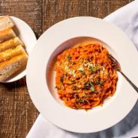 Spaghetti Bolognese · Spaghetti tossed in a bolognese meat sauce.