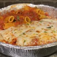 Chicken Parmigiana · Chicken cutlet topped with a marinara sauce with a golden layer of baked mozzarella. Served ...
