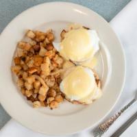 Classic Eggs Benedict · Two English muffin halves topped with Canadian bacon, poached eggs and our special Hollandai...
