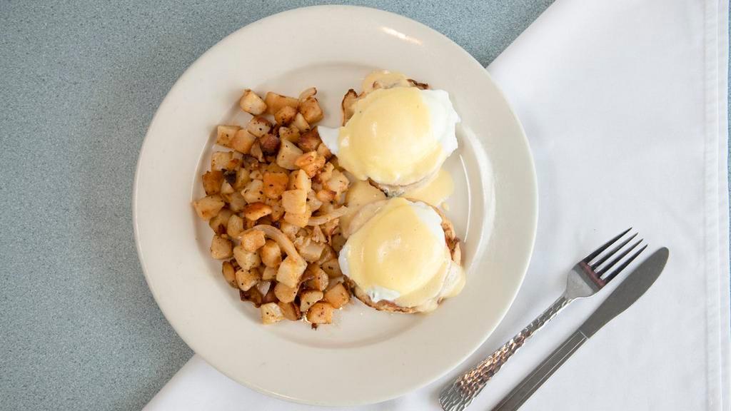 Classic Eggs Benedict · Two English muffin halves topped with Canadian bacon, poached eggs and our special Hollandaise sauce.