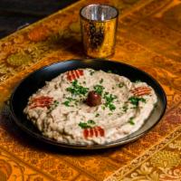 Moutabal (Baba Ghannouj) · Grilled eggplant, peeled and blended with sesame puree and lemon juice.