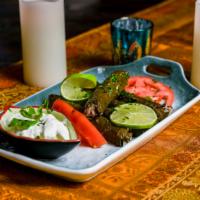 Grape Leaves (Dolmades Yalantzi) · Grape leaves stuffed with rice, parsley, seasoning.