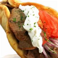 Greek Gyro · Gourmet beef and lamb seasoned to perfection. Includes lettuce, tomatoes, onions and tzatzik...