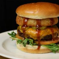Smokey Bbq Burger · Pickels, cheddar, onion rings, generously drizzled in BBQ sauce, & your choice of burger ser...