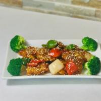 Sesame Chicken 芝麻鸡 · Fried chicken with Peking sauce, green peppers, red peppers, onions topped with sesame and g...