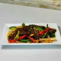 Mongolian Beef 蒙古牛 · Spicy.  Sliced beef with green peppers, red peppers, onions, scallions with Szechuan spicy s...