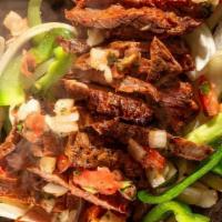 Beef Fajitas · Tenderloin cut in strips with onions, green peppers and four tortillas, plus pico de gallo, ...