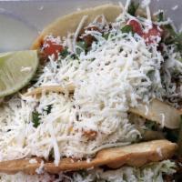 Taco Al Pastor · Spicy pork tacos.