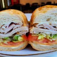 Turkey (Wrap Or Sandwich) · Turkey Breast, Lettuce, Tomato, Red Onion, Cheese and Mayo with Additional Dressing of Your ...