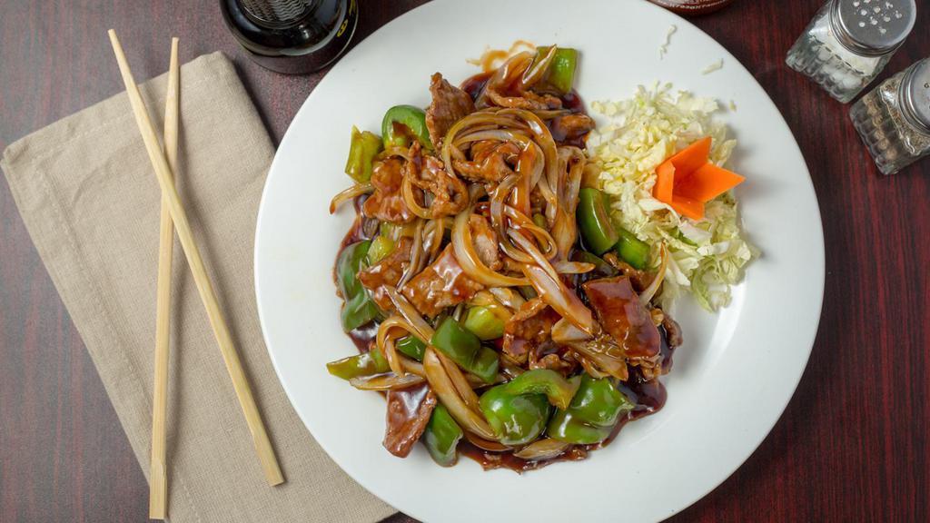 Mongolian · Hot and spicy. Spicy Mongolian sauce, white and green onion, red pepper with crispy rice noodle.